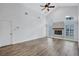 Bright living room boasting vaulted ceiling, modern ceiling fan, fireplace, and neutral walls at 4506 17Th W St, Palmetto, FL 34221
