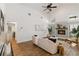Bright living room featuring vaulted ceilings, wood floors, and modern decor at 4506 17Th W St, Palmetto, FL 34221