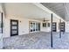 Wide angle shot of the patio showing the full brick floor and three access doors at 4506 17Th W St, Palmetto, FL 34221