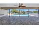 Wide angle shot of the patio showing the ceiling fan and view of the pool and canal at 4506 17Th W St, Palmetto, FL 34221