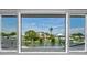 Window view of a body of water with docks and nice homes on a sunny day at 4506 17Th W St, Palmetto, FL 34221