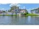 Waterfront home featuring a private dock and boat lift, perfect for boating enthusiasts at 4506 17Th W St, Palmetto, FL 34221