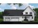 A spacious home with a three-car garage, classic black roof, and clean white siding for a modern look at 4704 Riverwood Ave, Sarasota, FL 34231