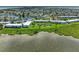 Attractive aerial view of waterfront condos with ponds, fountains, and manicured green space at 4736 Independence Dr # 4736, Bradenton, FL 34210