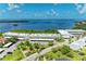 Stunning aerial view of waterfront condos, lush landscaping, and serene bay waters on a sunny day at 4736 Independence Dr # 4736, Bradenton, FL 34210