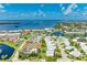 Beautiful aerial view of the condos, pool, tennis courts, and water features, offering a resort-style living at 4736 Independence Dr # 4736, Bradenton, FL 34210