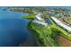 Scenic aerial view of waterfront condo buildings with lush green lawns and mature landscaping at 4736 Independence Dr # 4736, Bradenton, FL 34210