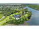 Beautiful aerial view highlighting a pond surrounded by lush green space and waterfront community at 4736 Independence Dr # 4736, Bradenton, FL 34210