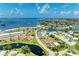Picturesque aerial view of the community with tennis courts, a pool, and serene waterfronts at 4736 Independence Dr # 4736, Bradenton, FL 34210