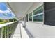 A spacious balcony area featuring a white wall, black shutters, and beautiful views at 4736 Independence Dr # 4736, Bradenton, FL 34210