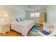 Bedroom with hardwood floors features a ceiling fan and bright window at 4736 Independence Dr # 4736, Bradenton, FL 34210