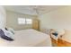 Comfortable bedroom with a bright window, ceiling fan and hardwood flooring at 4736 Independence Dr # 4736, Bradenton, FL 34210