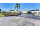 Inviting community clubhouse entrance with a circular driveway and covered drop-off area at 4736 Independence Dr # 4736, Bradenton, FL 34210
