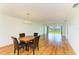 Bright dining room features hardwood floors and views of the beach and water at 4736 Independence Dr # 4736, Bradenton, FL 34210