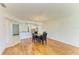Bright dining area features wood floors, pendant lighting, and an open layout to the kitchen at 4736 Independence Dr # 4736, Bradenton, FL 34210