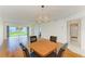 Open dining area features a modern chandelier and view of the backyard at 4736 Independence Dr # 4736, Bradenton, FL 34210