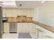 Open concept kitchen has granite countertops and stainless-steel appliances at 4736 Independence Dr # 4736, Bradenton, FL 34210