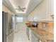Bright kitchen features granite counters, stainless steel appliances, and tile flooring at 4736 Independence Dr # 4736, Bradenton, FL 34210