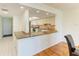 Kitchen with granite countertops and stainless-steel appliances opens to dining area at 4736 Independence Dr # 4736, Bradenton, FL 34210