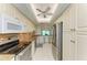 Open kitchen features granite counters, stainless steel appliances, and breakfast bar at 4736 Independence Dr # 4736, Bradenton, FL 34210