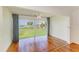 Living room with scenic views visible through a large window, showcasing natural light and charm at 4736 Independence Dr # 4736, Bradenton, FL 34210