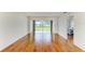 Spacious living room features wood floors, plenty of natural light, and view of backyard at 4736 Independence Dr # 4736, Bradenton, FL 34210