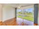 Living room featuring wood floors and a large window offering lovely views and ample natural light at 4736 Independence Dr # 4736, Bradenton, FL 34210