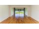 Spacious living area showcasing wood floors and a large window with backyard views at 4736 Independence Dr # 4736, Bradenton, FL 34210