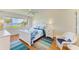 Bright bedroom featuring a water view, ceiling fan, and coastal decor at 4736 Independence Dr # 4736, Bradenton, FL 34210