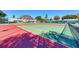 Well-maintained tennis court surrounded by lush greenery and secure fencing at 4736 Independence Dr # 4736, Bradenton, FL 34210