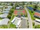 Aerial view of community tennis and bocce ball courts, with adjacent parking and landscaping at 4736 Independence Dr # 4736, Bradenton, FL 34210
