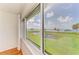 Relaxing water views from the home's windows with palm trees and bright blue skies at 4736 Independence Dr # 4736, Bradenton, FL 34210