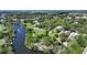 Aerial view of waterfront homes with private docks on the river at 4771 Riverwood Cir, Sarasota, FL 34231