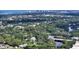 Aerial view of the property nestled in a grove of trees with waterfront access at 4771 Riverwood Cir, Sarasota, FL 34231