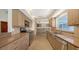 Modern kitchen with stainless steel appliances, custom cabinetry, and ample counter space at 4771 Riverwood Cir, Sarasota, FL 34231