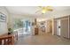 Bright kitchen with tile floors, view of backyard pool, and stainless steel appliances at 4771 Riverwood Cir, Sarasota, FL 34231