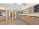 Spacious kitchen with modern cabinets, tile floors, and plenty of counter space at 4771 Riverwood Cir, Sarasota, FL 34231