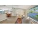 Bright and airy living room with vaulted ceilings, neutral decor, and a view of the outdoors at 4771 Riverwood Cir, Sarasota, FL 34231