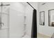 Modern bathroom with white tiled shower and black hardware at 4833 San Palermo Dr, Bradenton, FL 34208
