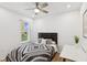 Cozy bedroom with a ceiling fan, wood floors, and plenty of natural light at 4833 San Palermo Dr, Bradenton, FL 34208
