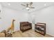 Bedroom featuring a ceiling fan, wood floors, crib, and giraffe at 4833 San Palermo Dr, Bradenton, FL 34208