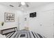 Inviting bedroom with a ceiling fan, closet, and en suite bathroom at 4833 San Palermo Dr, Bradenton, FL 34208