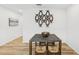 Dining area with a rustic table and artistic wall decor, adjacent to other rooms at 4833 San Palermo Dr, Bradenton, FL 34208