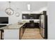 Modern kitchen features granite countertops, stainless steel appliances, and elegant pendant lighting at 4833 San Palermo Dr, Bradenton, FL 34208
