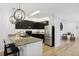Well-appointed kitchen with granite countertop, stainless appliances, and modern pendant lights at 4833 San Palermo Dr, Bradenton, FL 34208