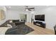 Spacious living room with comfortable sectional sofa, wood floors, and natural light at 4833 San Palermo Dr, Bradenton, FL 34208