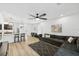 Spacious living room featuring an open layout and modern furnishings with a kitchen in the background at 4833 San Palermo Dr, Bradenton, FL 34208