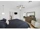Well lit main bedroom featuring a ceiling fan, ensuite bathroom and adjacent sitting area at 4833 San Palermo Dr, Bradenton, FL 34208