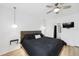 Bright main bedroom with modern lighting, ceiling fan, and ensuite bathroom at 4833 San Palermo Dr, Bradenton, FL 34208
