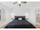Clean bedroom showcasing a comfortable bed, ceiling fan, and minimalist decor at 4833 San Palermo Dr, Bradenton, FL 34208